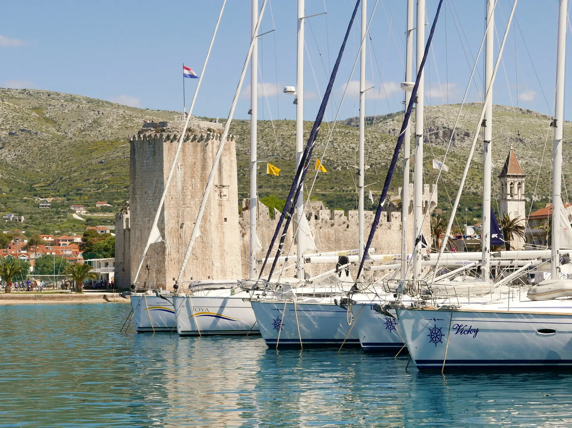 old fortess at the coast with sailing boats