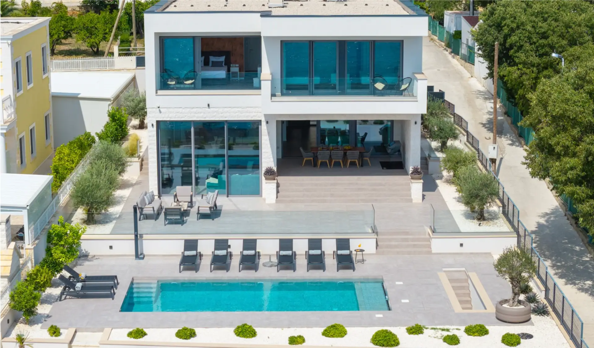 aerial view of a villa with a pool