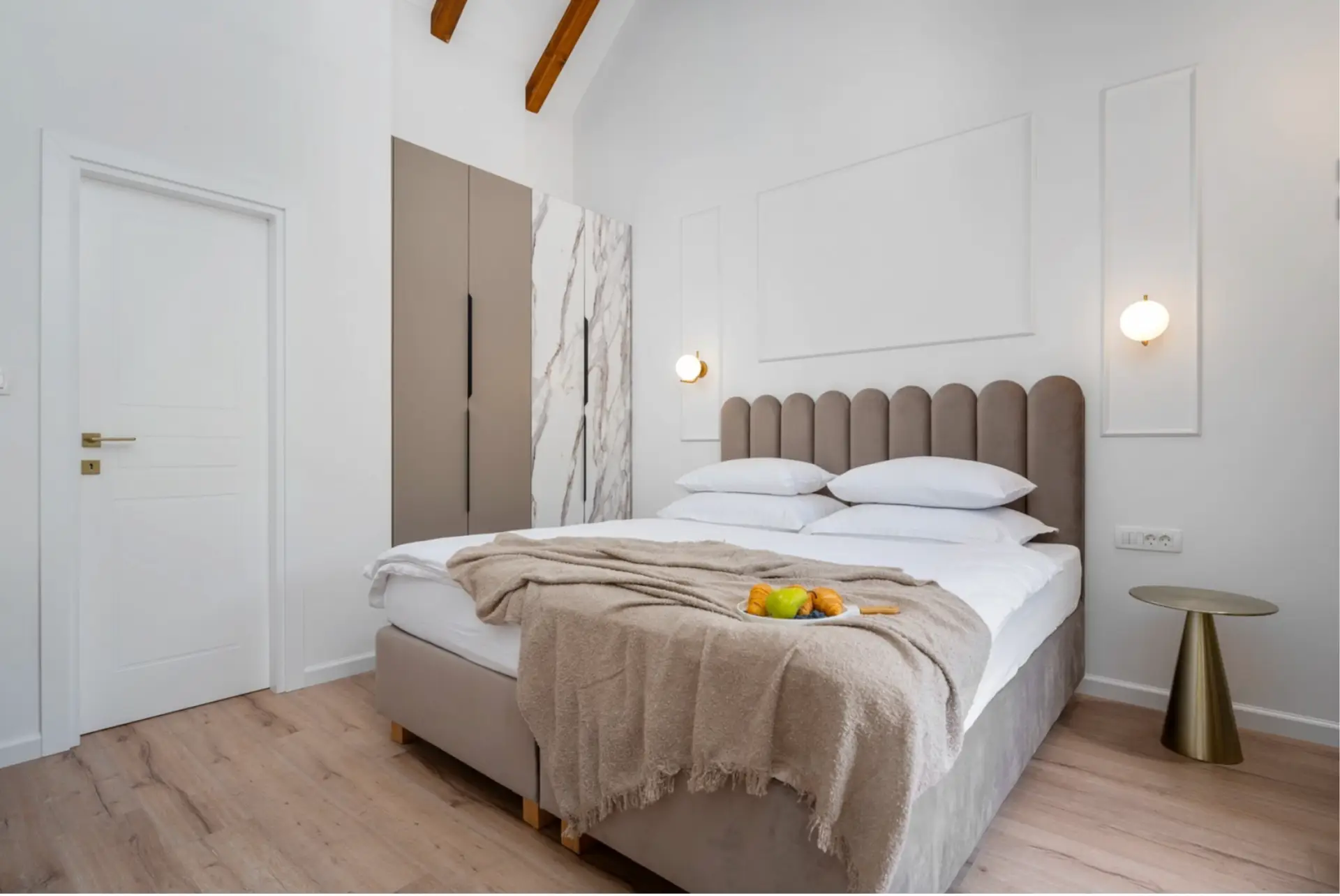 beige bed with white linnen