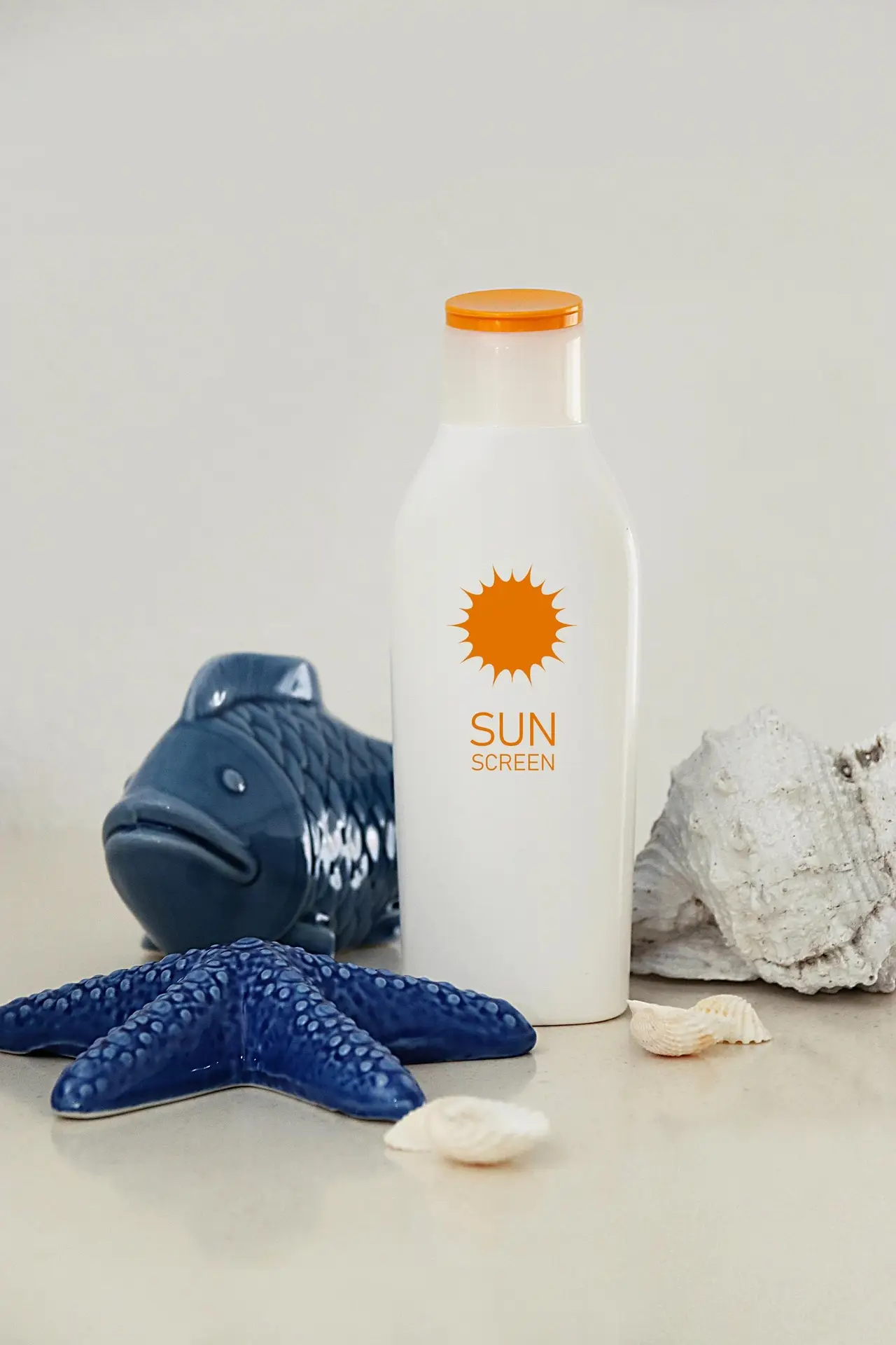 buttle of a spf lotion with sea creatures figurines