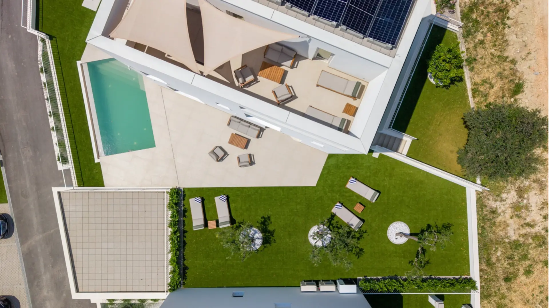 aerial view of a villa with a pool