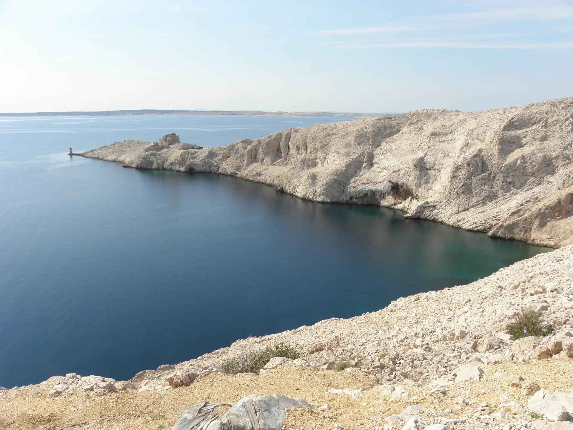 rocky limestone island surrounded by the sea