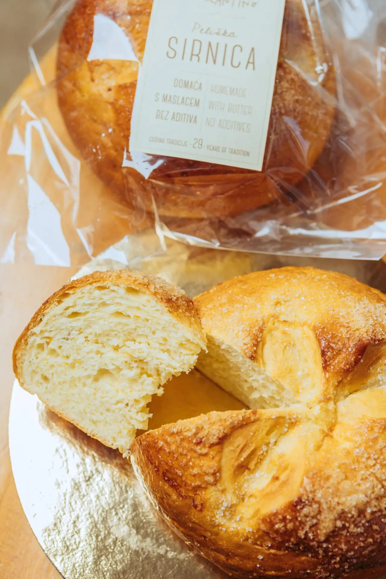 A sweet bread in a foil packaging with a card