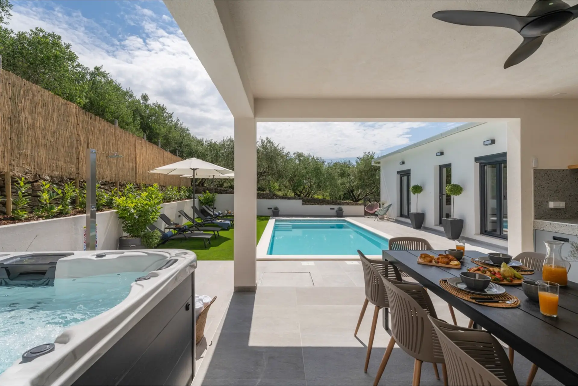 outdoor terrace with pool, whirpool and dining table
