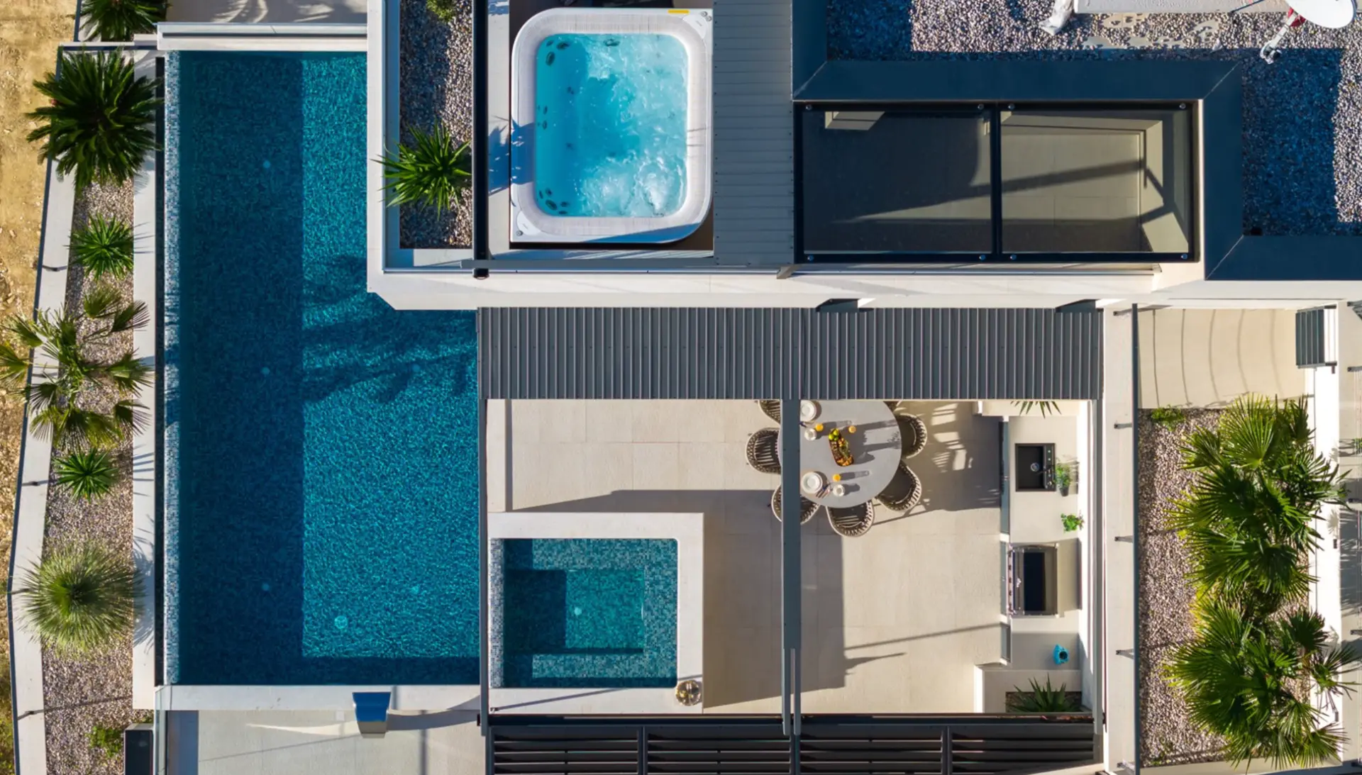 aerial view of a villa pool and whirpool and dining table