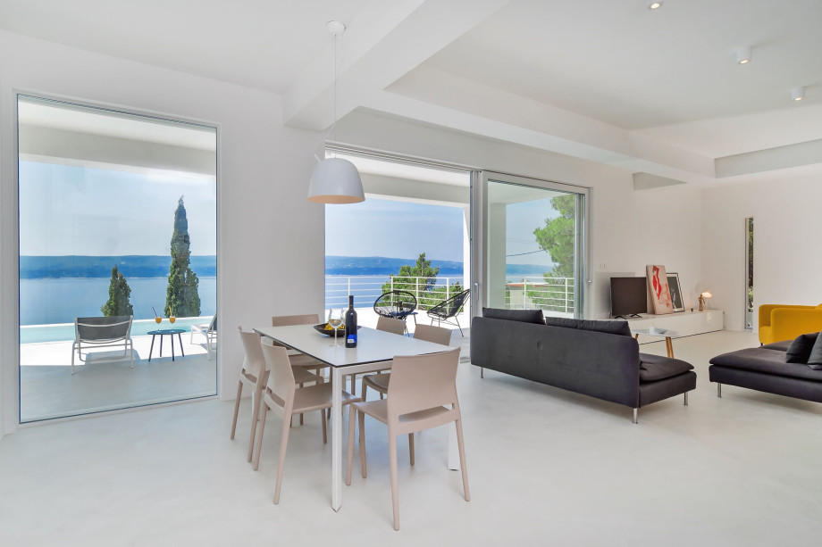 Fully equipped kitchen with dining and living area