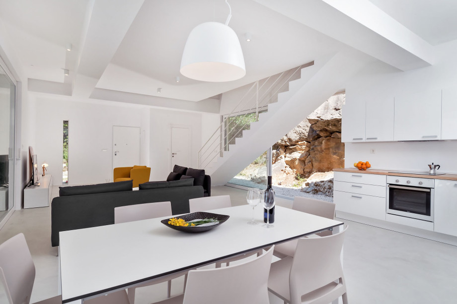 Fully equipped kitchen with dining and living area