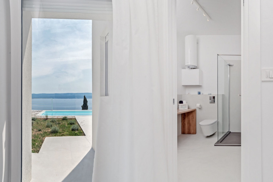 One of three en-suite bathrooms with shower and direct exit outside