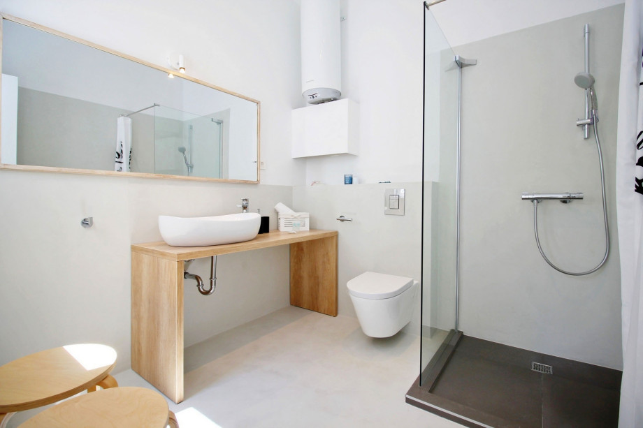 One of three en-suite bathrooms with shower and direct exit outside