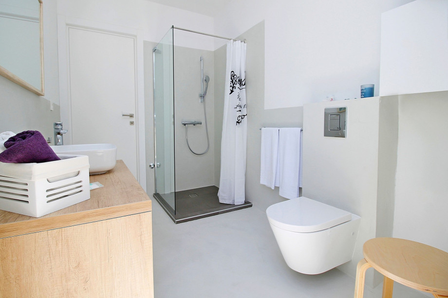 One of three en-suite bathrooms with shower and direct exit outside
