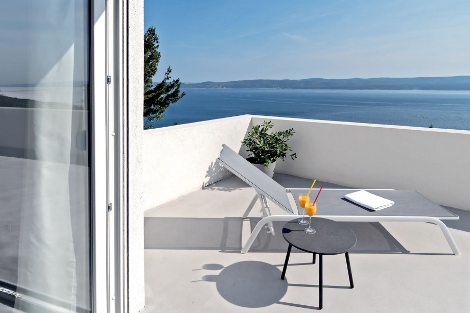 Terrace in front of the bedrooms on 2nd floor with outdoor furniture & sea view