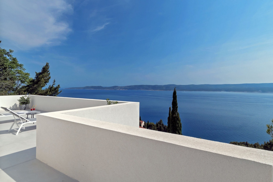 Terrace in front of the bedrooms on 2nd floor with outdoor furniture & sea view