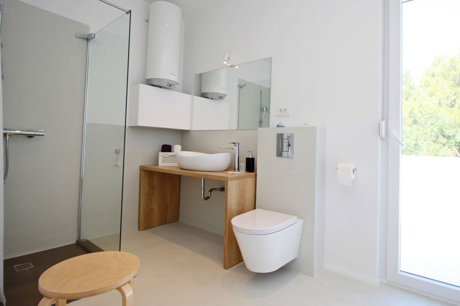 One of three en-suite bathrooms with shower and direct exit outside