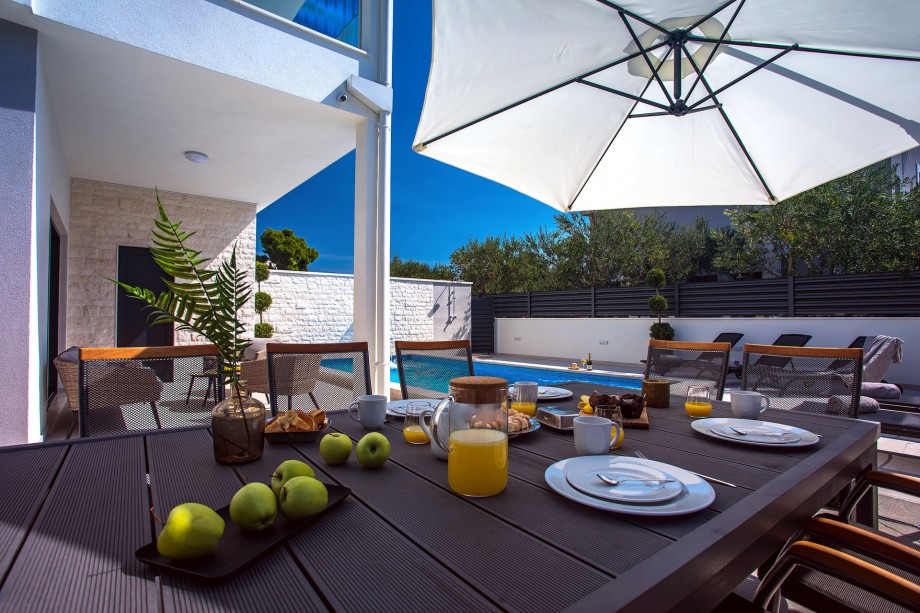Spacious outdoor dining area with barbecue