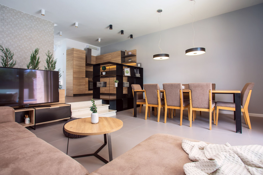 modern dinning and living area in front of the beautiful outdoor area