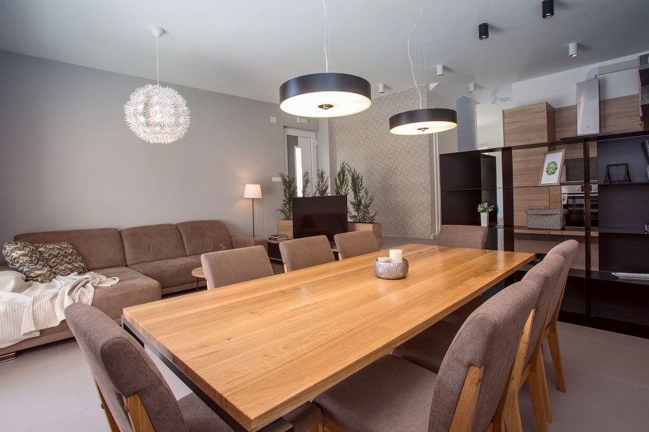 modern dining and living area in front of the beautiful outdoor area