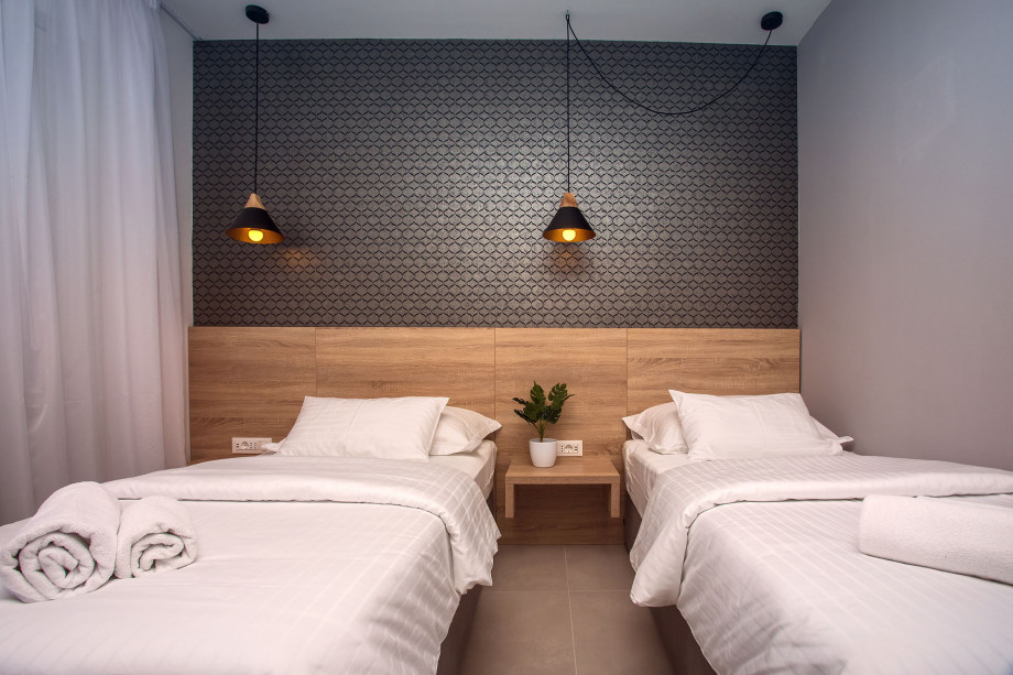 Bedroom No. 2 with two single beds with en-suite and exit to terrace