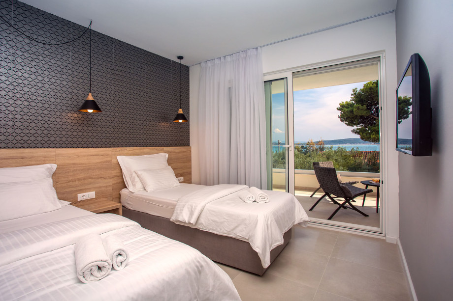 Bedroom No.4 with 2 single beds with en-suite and exit to terrace