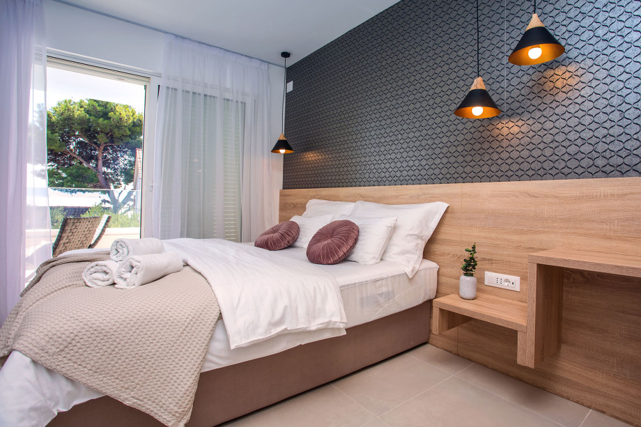 Bedroom No.5 with double bed with en-suite and exit to terrace