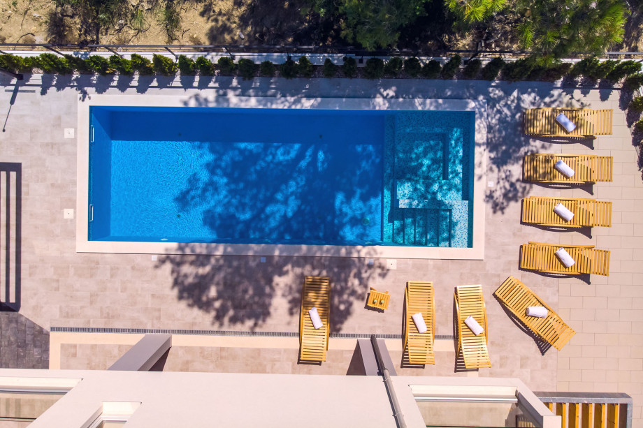 Heated 33sqm pool with attached 5sqm whirlpool and 8 comfortable lounge chairs