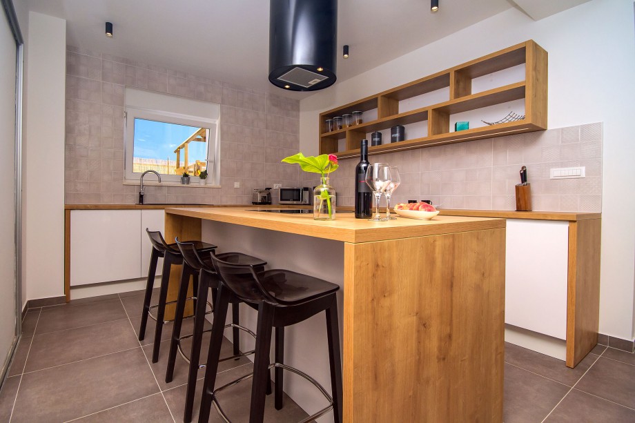 Fully equipped kitchen with all amenities you might need for comfortable stay