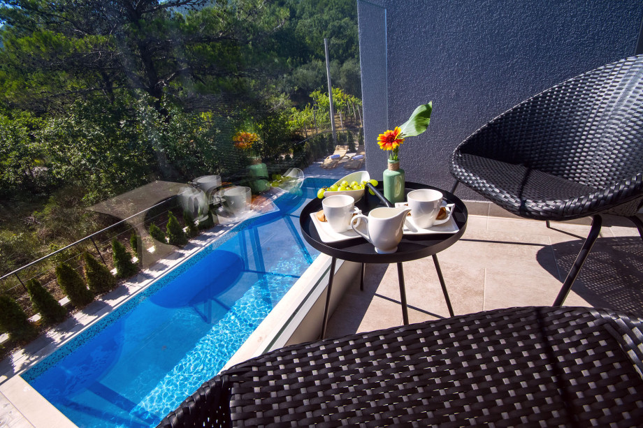 Balcony in front of the bedroom No.1 with pool view