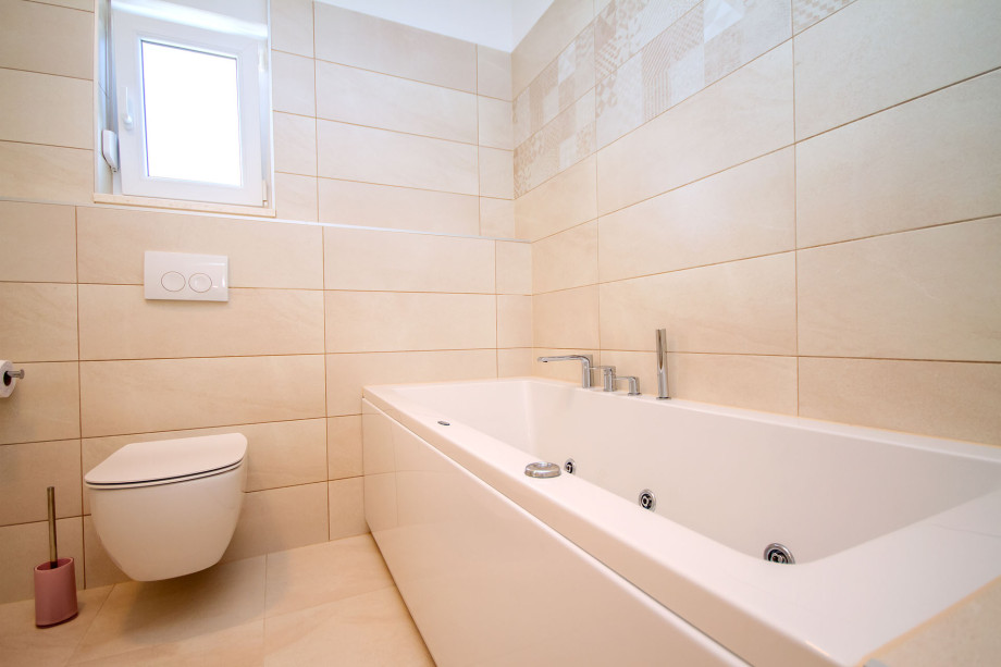 Ensuite bathroom with massage bathtub and shower in bedroom No.1