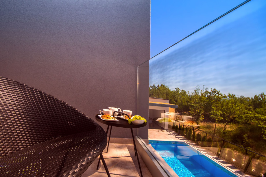 Balcony in front of the bedroom No.2 with pool view