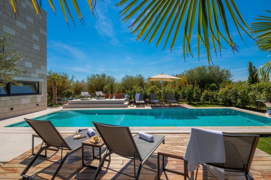 Private outdoor pool 12m x 5m settled on the sandy beach