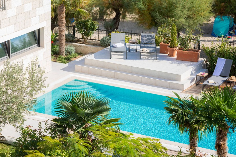 Sandy beach is just behind the fence, and still, the privacy at the property is guaranteed