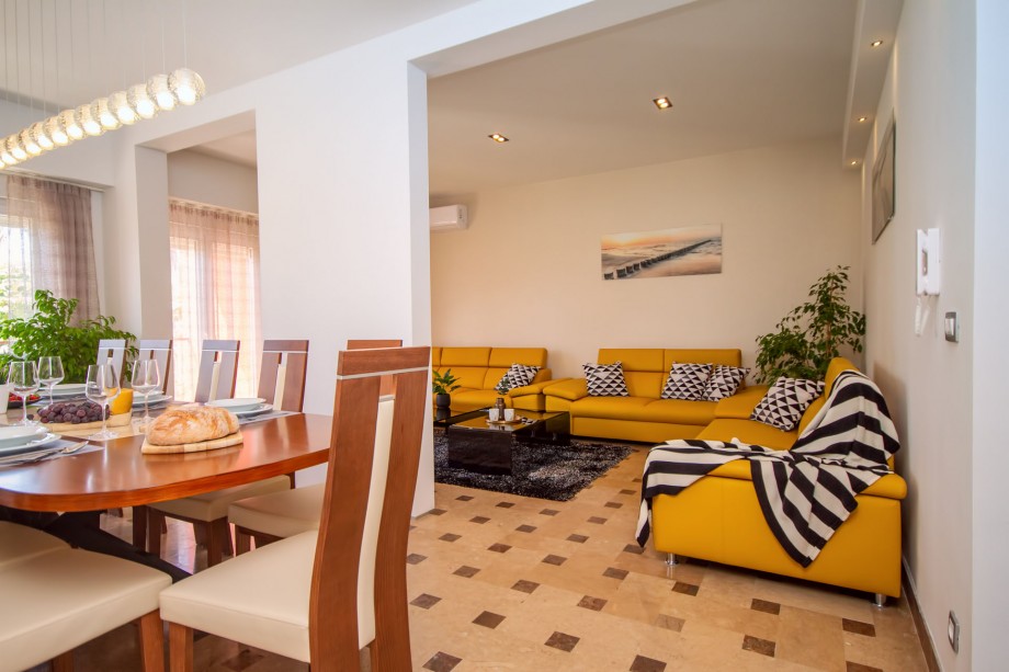 Comfortable dining and living area with direct exit to the outdoor dining area