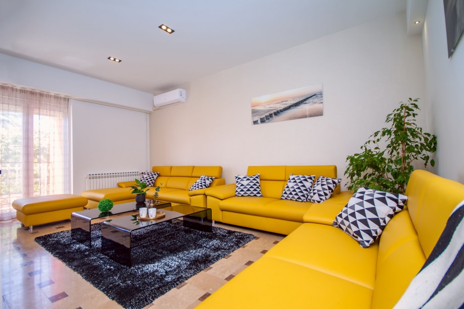 Comfortable dining and living area with direct exit to the outdoor dining area