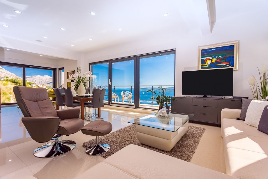 A spacious airconditioned  living room with TV, PS4 for your youngers