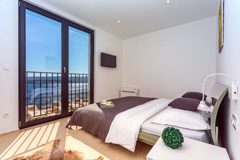 Bedroom No1 with King size bed 180x200cm with opened sea and pool views