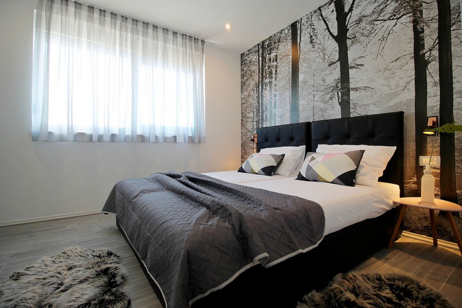 Bedroom on 1st floor with two single beds which can be connected