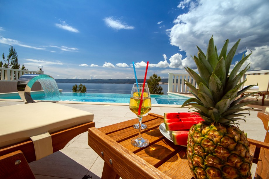 Pool area with 8 comfortable sun loungers, open sea view