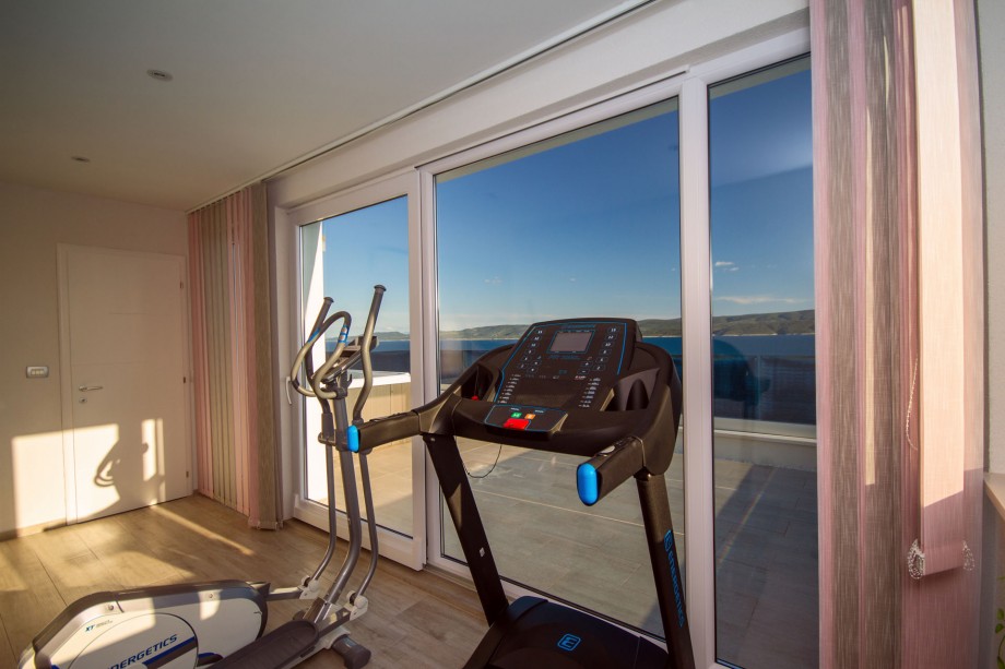 Gym on the last floor of the house with sea view