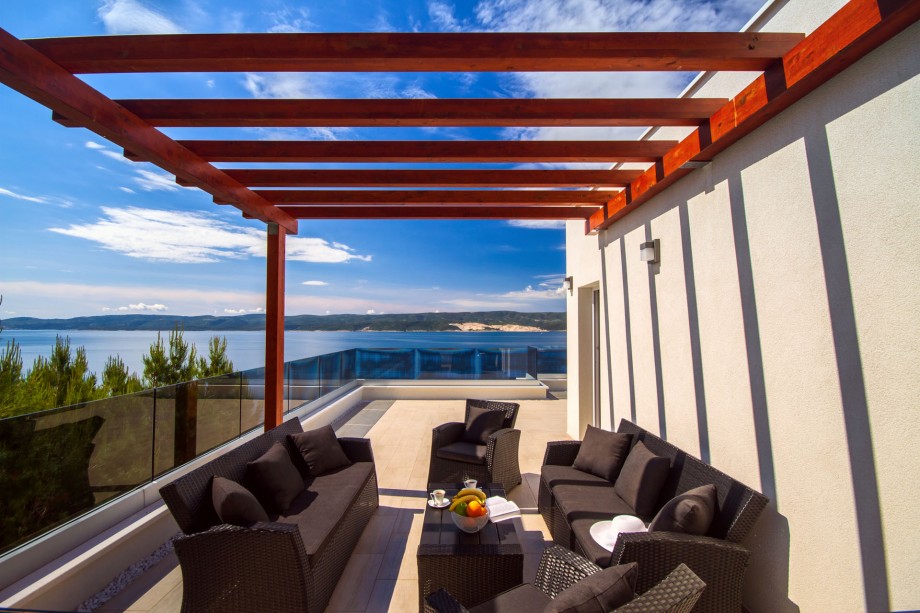 Amazing sea view from the roof terrace, behind the hot tub and gym