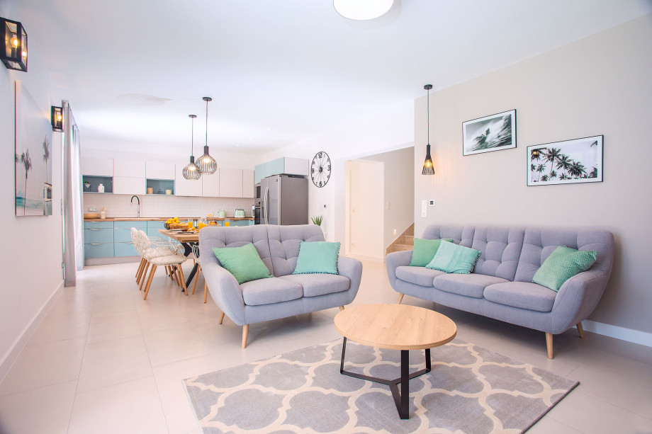 Modern and light living and dining area with direct exit to the pool