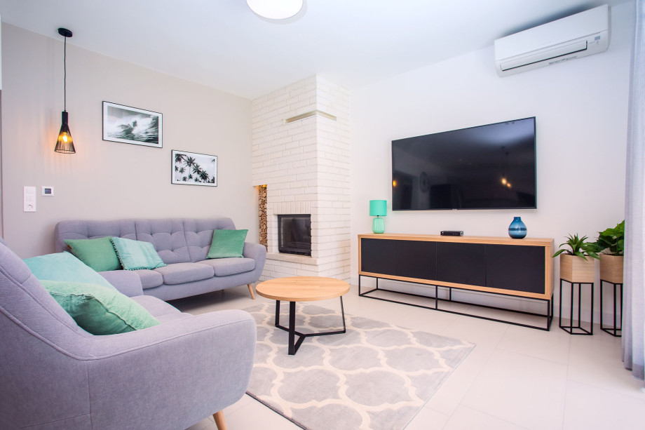 Living area with fireplace, open sea view from every corner of the property