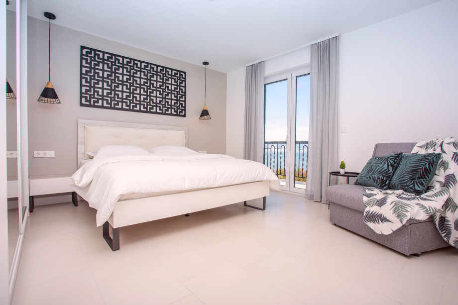 En-suite bedroom No.3 on 1st floor with king-size bed and sofa bed, balcony