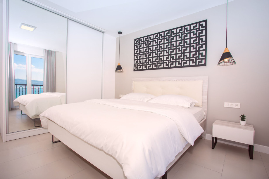 En-suite bedroom No.3 on 1st floor with king-size bed and sofa bed, balcony