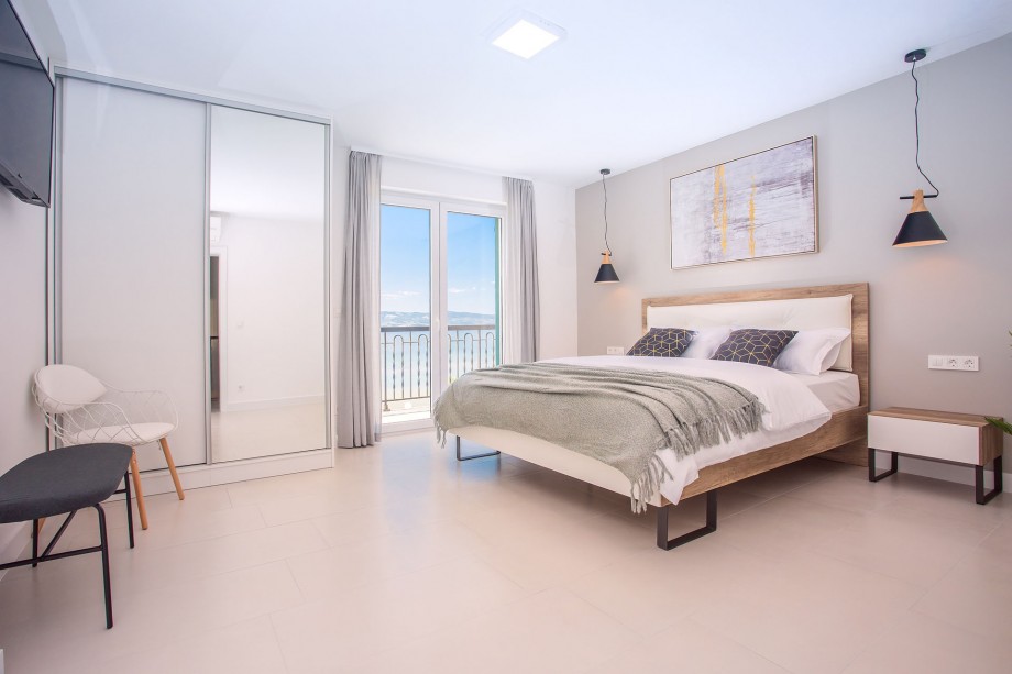 En-suite bedroom No.4 with king-size bed, exit to the balcony, TV, AC