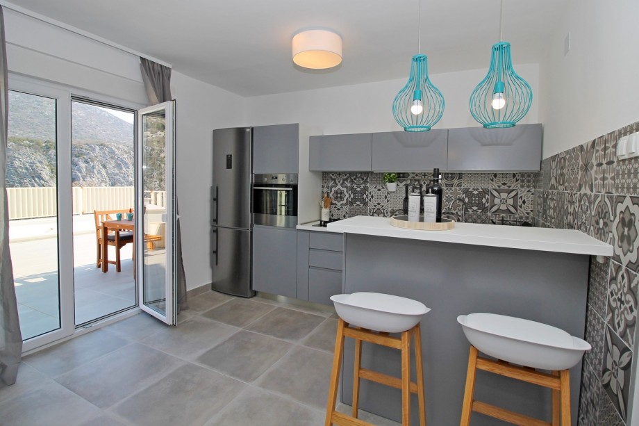 Fully equipped kitchen with dining area&exit to pool area + barbecue&Playground