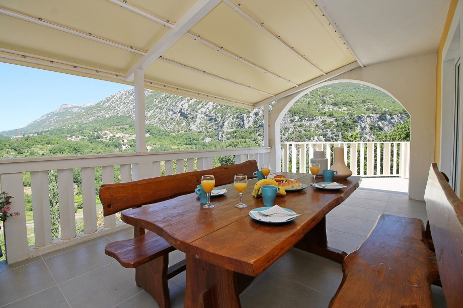 outside dinning area in front of the inside living and dinning area