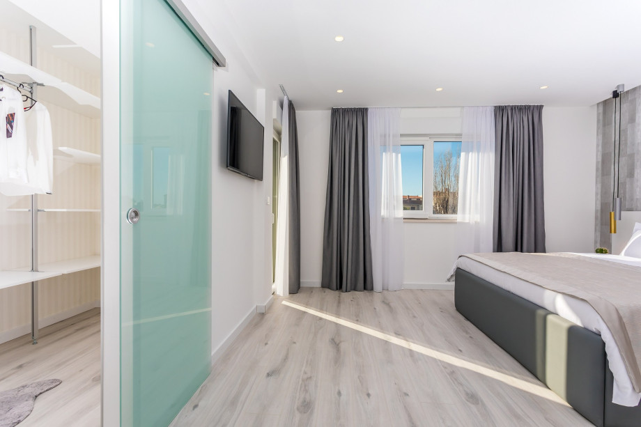 Master Bedroom No.2 with a king-size bed and walk-in closet