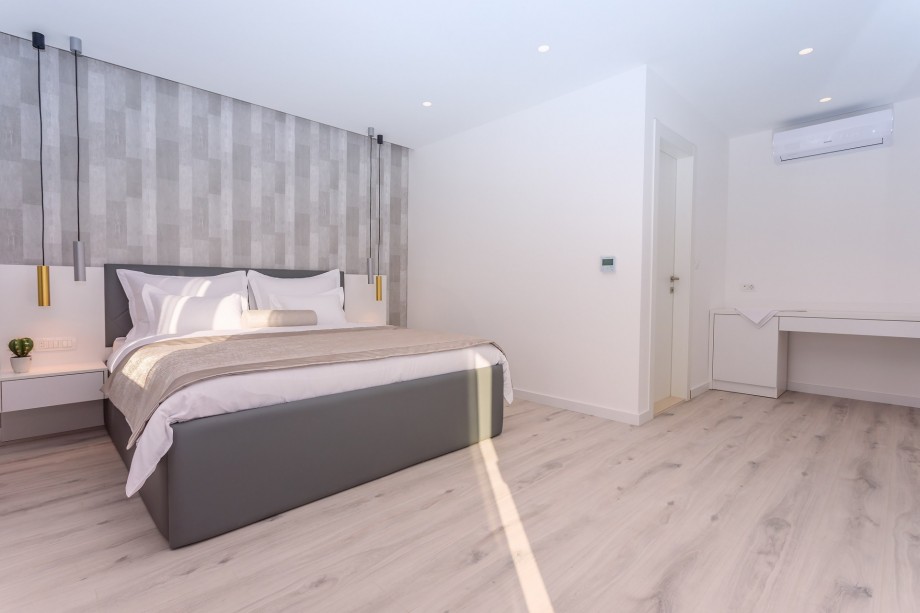 Master Bedroom No.2 with a king-size bed and walk-in closet