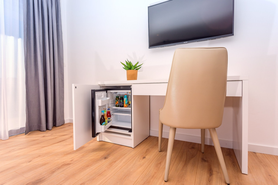 In every bedroom are mini-bar, TV, AC, and  laptop table with chair