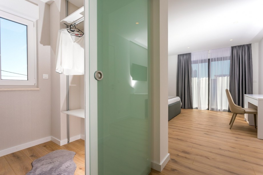A spacious walk-in closet and  en-suite bathroom with a shower in bedroom No.3