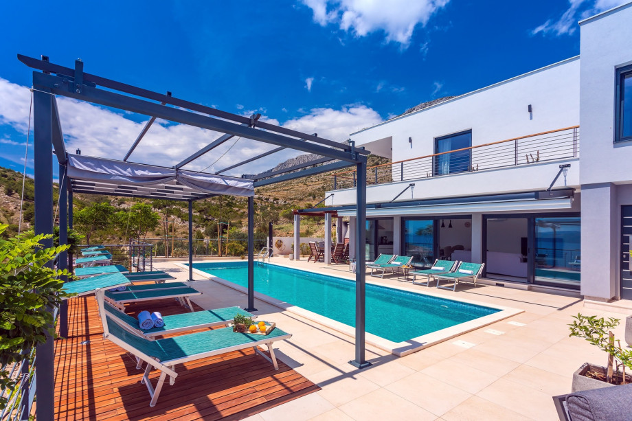 covered outdoor dining area with barbecue